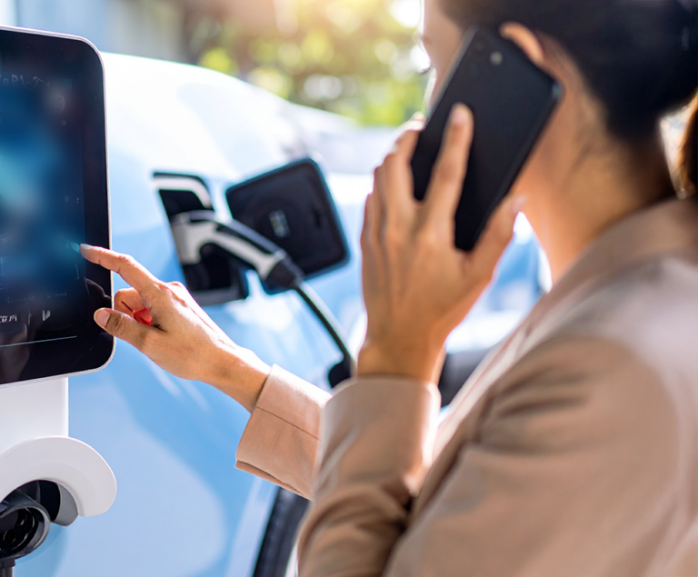 ARC Europe agent providing EV charge station assistance with on-site troubleshooting and support
